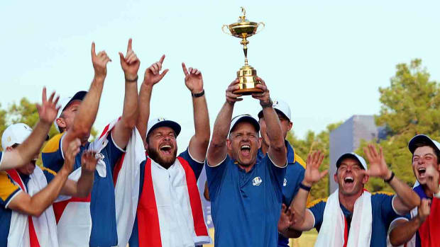 Team Europe captain Luke Donald and Team Europe celebrates with the Ryder Cup after beating Team USA during the final day of the 2023 Ryder Cup at Marco Simone Golf and Country Club.